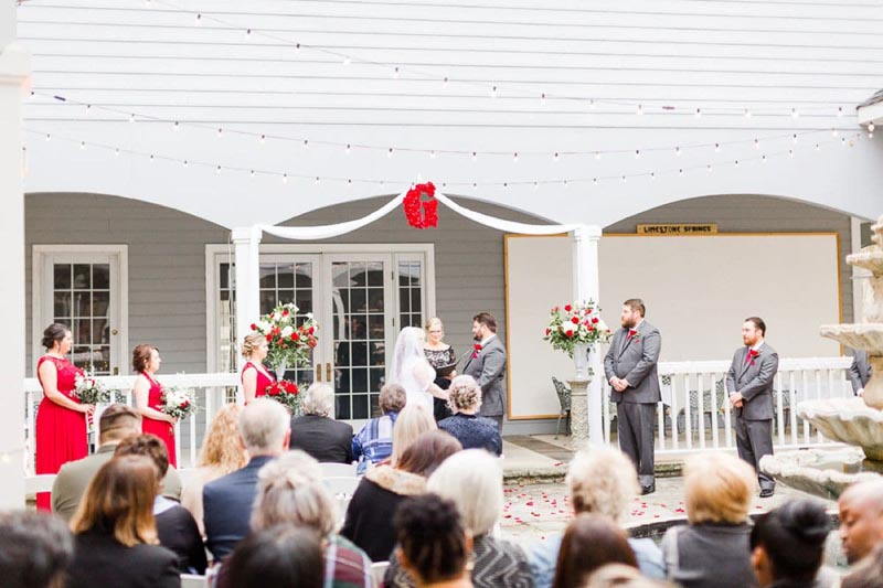 Wedding ceremony in outdoor reception area. 