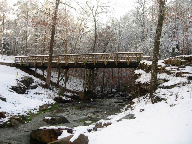 bridge on golf course covered with snow 